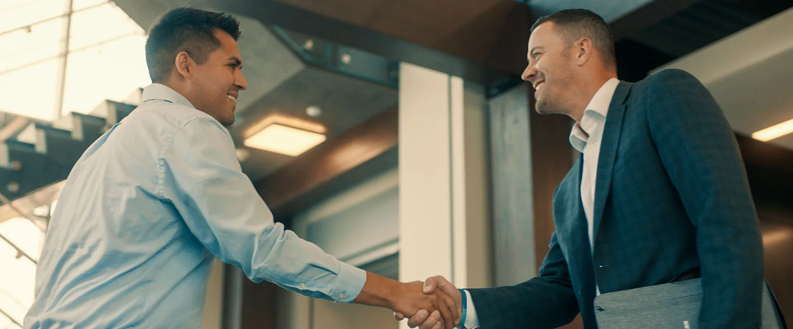 Two business men shaking hands